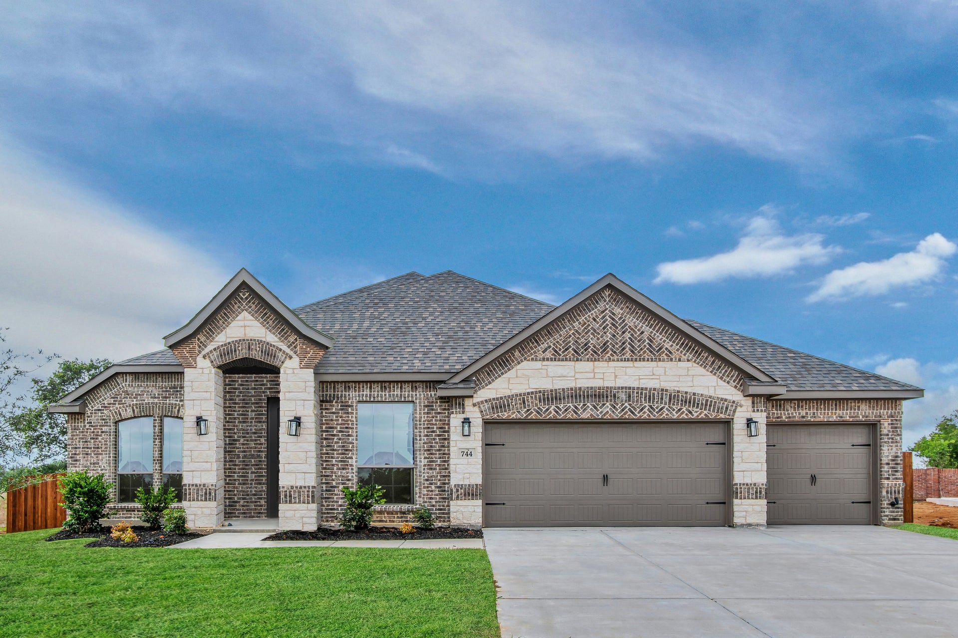 2671 A with Stone and 3-car garage. 2,671sf New Home